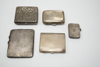 Three assorted silver cigarette cases including Art Deco, largest 10.1cm, a silver vesta case and a white metal cigarette case.